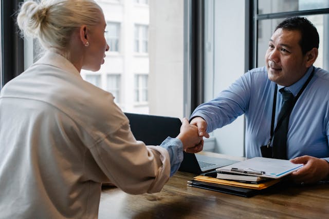 a-landlord-and-tenant-shaking-hands-after-signing-a-contract a-landlord-and-tenant-shaking-hands-after-signing-a-contract