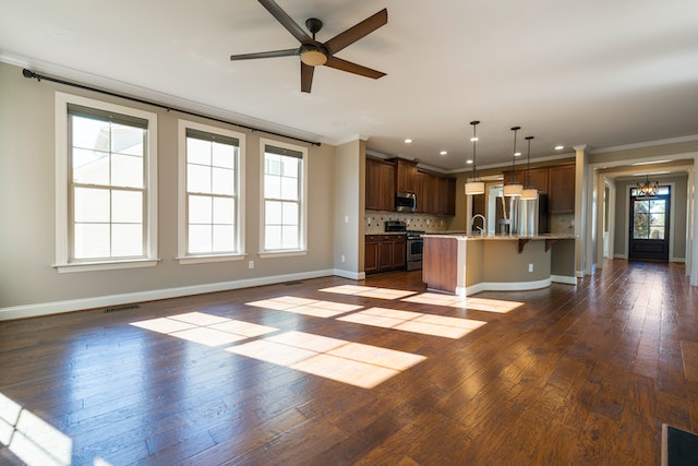 unfurnished-main-floor-with-an-open-concept-layout-and-three-large-windows unfurnished-main-floor-with-an-open-concept-layout-and-three-large-windows