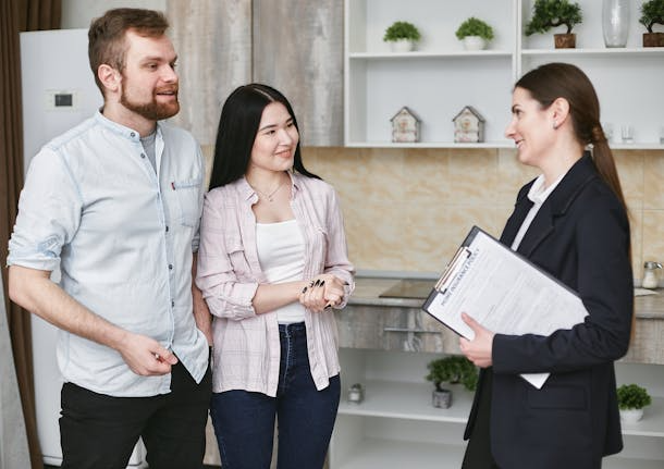 a-landlord-speaking-with-two-prospective-tenants